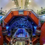 An artistic rendering of the LHC discovery involving lead atoms changing into gold.