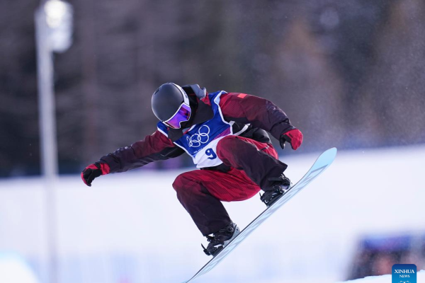 Athletes competing in the Winter Olympics halfpipe qualification event.
