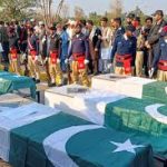 Police patrol following a northwest Pakistan ambush in Kohat.
