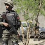 Police patrol the area following a Kohat police ambush.