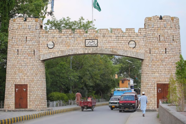 Local residents checking Peshawar Sehri time today on a calendar.