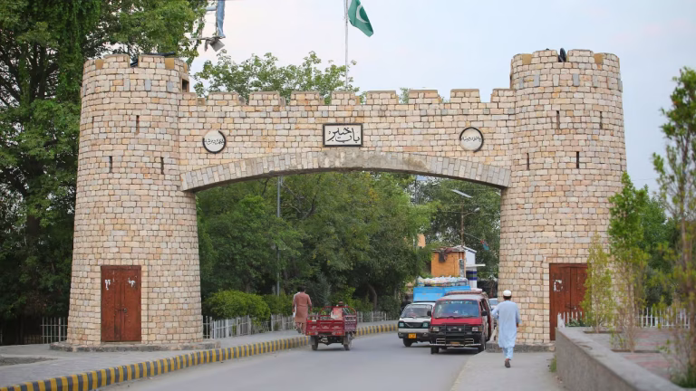 Local residents checking Peshawar Sehri time today on a calendar.